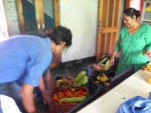 This is Salochana, our community centre helper who helps prepare the bags and crates and Ravi who has come in to load them into the new Sumo jeep, recently donated by the Dalai Lama Trust.