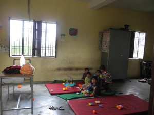 Today it looks particularly bare and damp – lucky the kids have the mats we provided to sit on on that damp floor!