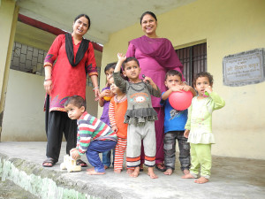 Then they all pose for a picture on the verandha before we continue up the hill to Chatwan School and anganwari.