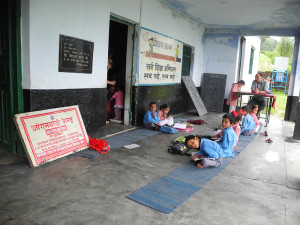 Classes are usually held on the verandha with the children sitting on thin mats on the ground.