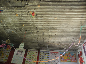 Understandably the parents are worried that it might fall down in heavy rain. This is the condition of the ceiling. They did not even have electricity until we put it in for them.