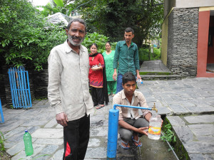 Just by the way, here are two men from a local construction site filling their containers with safe drinking water from our filter system.