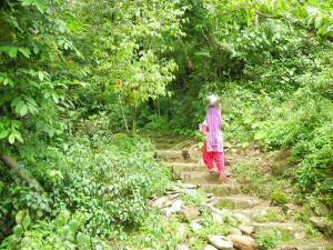 We follow a woman carrying her water pot up the hill to the anganwari where the children have just gone home.